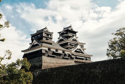 Low angle view of kumamoto castle against sky