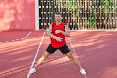 Full length of man playing soccer