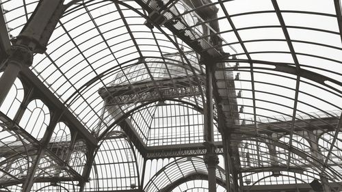 Interior of palacio de cristal against clear sky