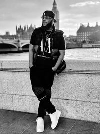 Portrait of young woman standing on street