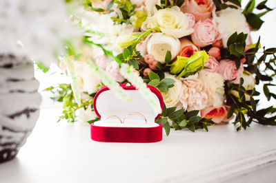 Close-up of red roses on table