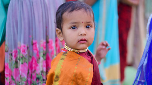 Portrait of cute girl wearing sari while standing outdoors