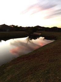 Scenic view of lake against sky during sunset