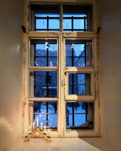 Abandoned building seen through window