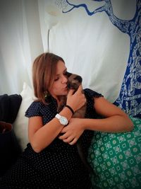 Woman lying down on bed at home