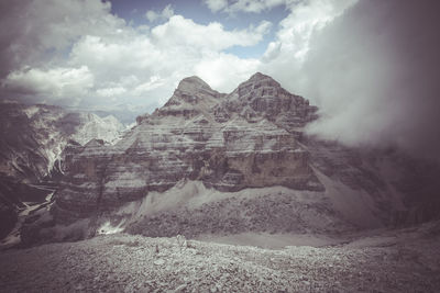 Scenic view of mountain against cloudy sky