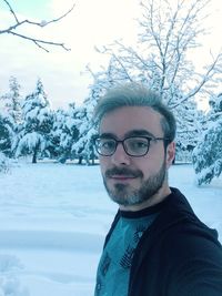 Portrait of young man in snow