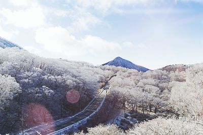 High angle view of road amidst mountains against sky