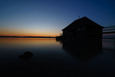 Scenic view of sea against clear sky during sunset