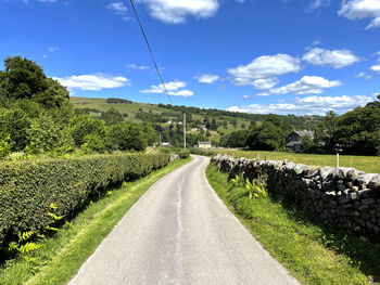 Country lane near silver hill, with stone walls, farms and hills in, pateley bridge, harrogate, uk