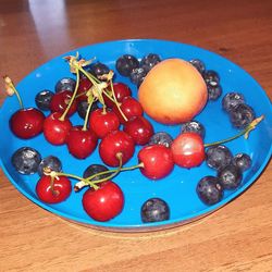 High angle view of fruits in plate on table