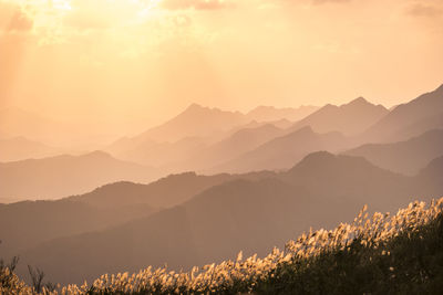 Scenic view of mountains against sky during sunset