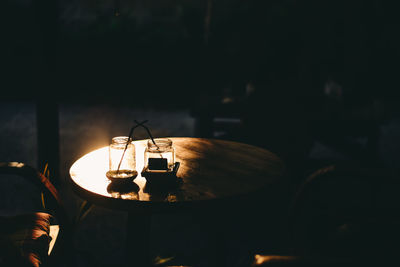 View of tea light candles on table