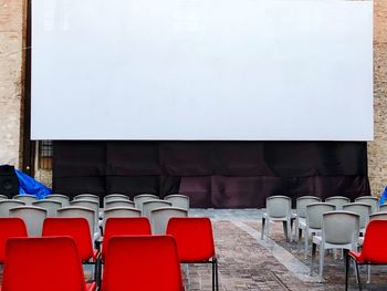 Empty chairs and screen, open air cinema
