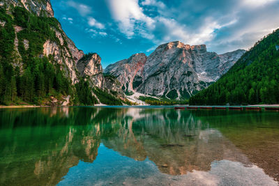 Scenic view of lake and mountains against sky