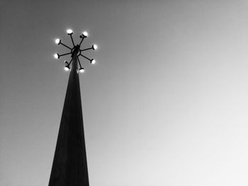 Low angle view of illuminated street light against sky