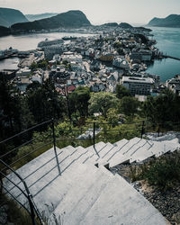 High angle view of townscape by sea