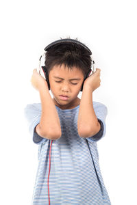 Boy wearing sunglasses against white background