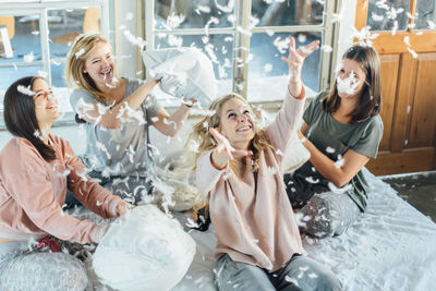 Five girls in a pillow fight