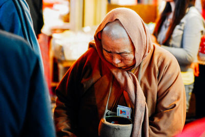 Close-up of woman in background