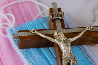 High angle view of cross on table