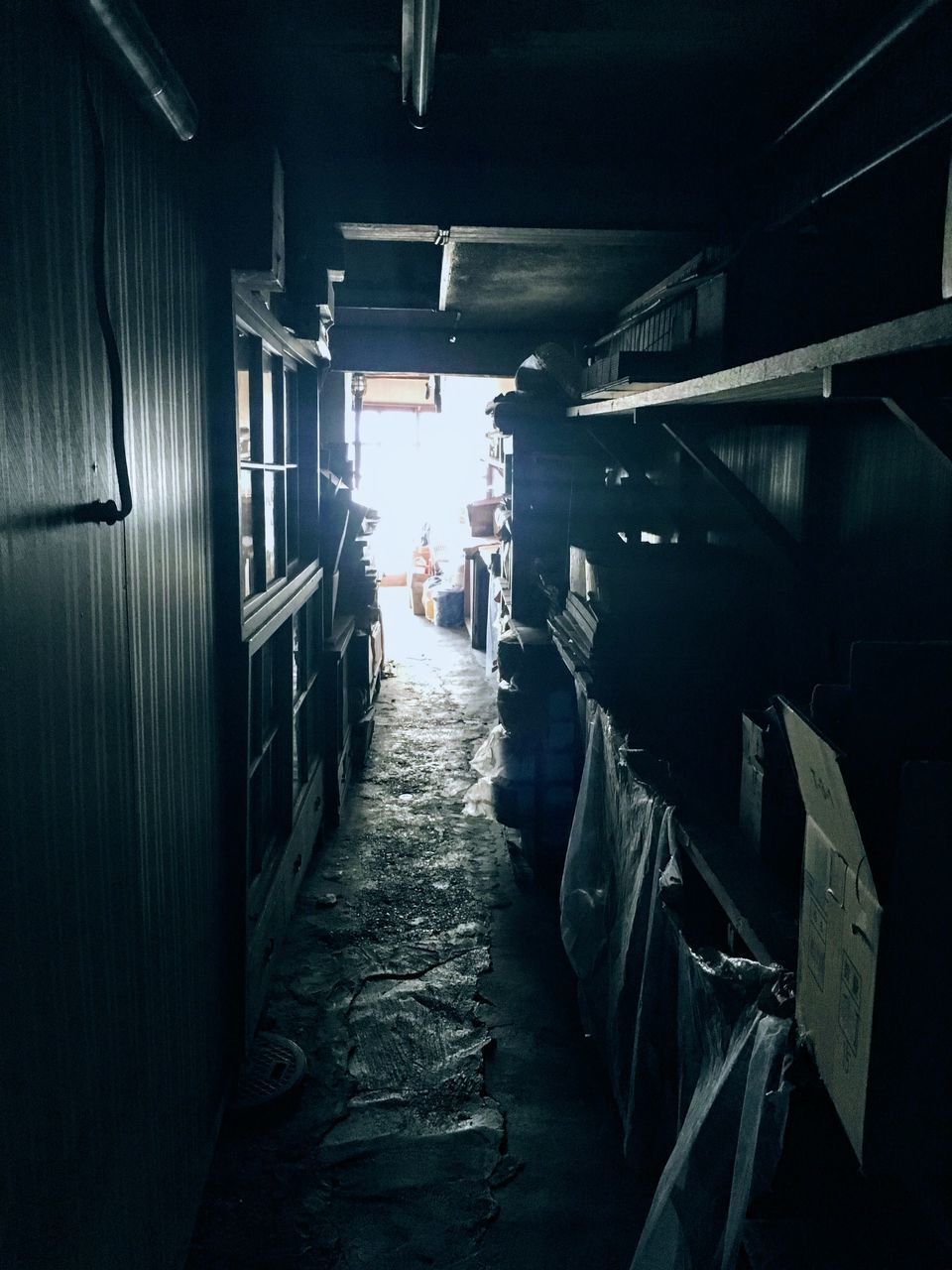 MAN WALKING ON NARROW ALLEY