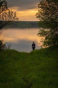 Scenic view of lake against sky during sunset