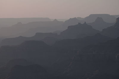 Scenic view of silhouette mountains against sky