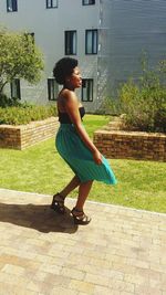 Full length of woman standing on footbridge