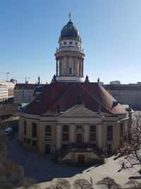 Clock tower against sky in city