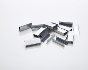 Close-up of stapler pins on white background