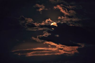 Low angle view of moon in sky at night