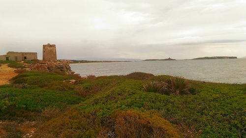 Scenic view of sea against cloudy sky