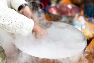 Midsection of woman preparing food