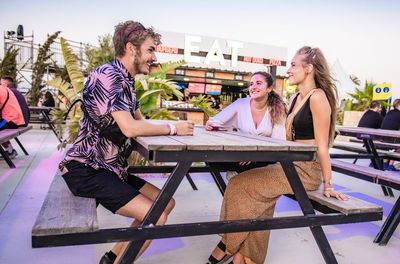 Young couple sitting on table