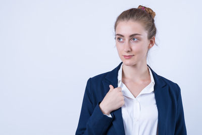 Portrait of a beautiful young woman over white background