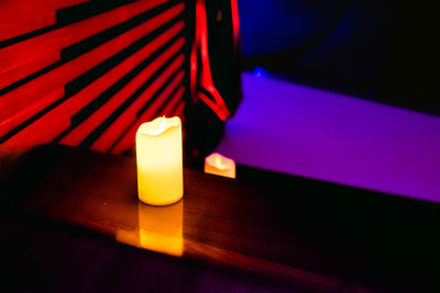 Close-up of illuminated lighting equipment on table