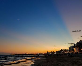 Scenic view of beach against sky during sunset