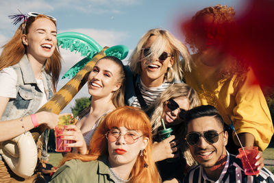 Portrait of happy young woman in sunglasses