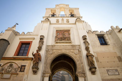 Low angle view of ornate building against sky