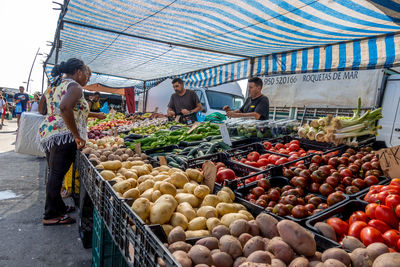 People at market stall