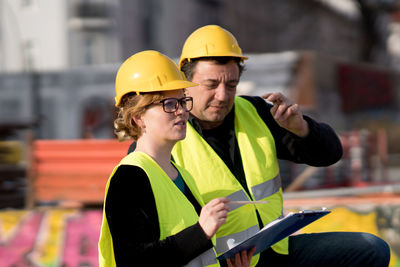 Man and woman working outdoors