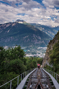 High angle view of bridge over mountains against sky