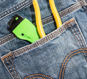 Close-up of work tools in back pocket