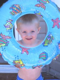 Portrait of happy boy playing