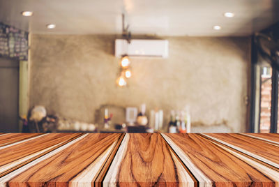 Wooden table at illuminated home