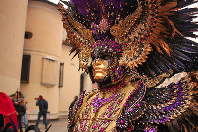 Venice carnival, italy. rear view of woman wearing mask.