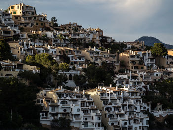 Houses in town against sky