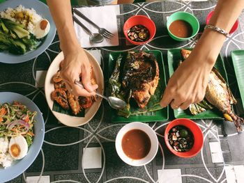 Woman serving food on table