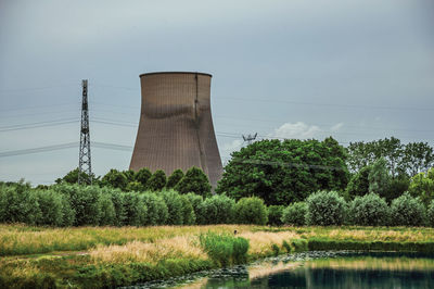 Canal and nuclear power plant near geertruidenberg. a small village in the netherlands countryside.